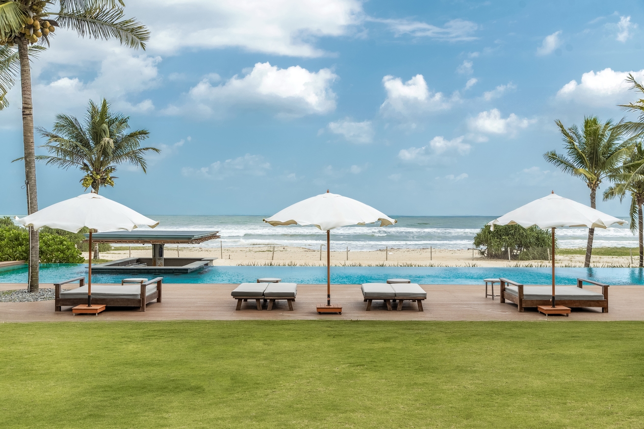 Luxury beach club interior in Vietnam, minimalist design with Mediterranean fusion