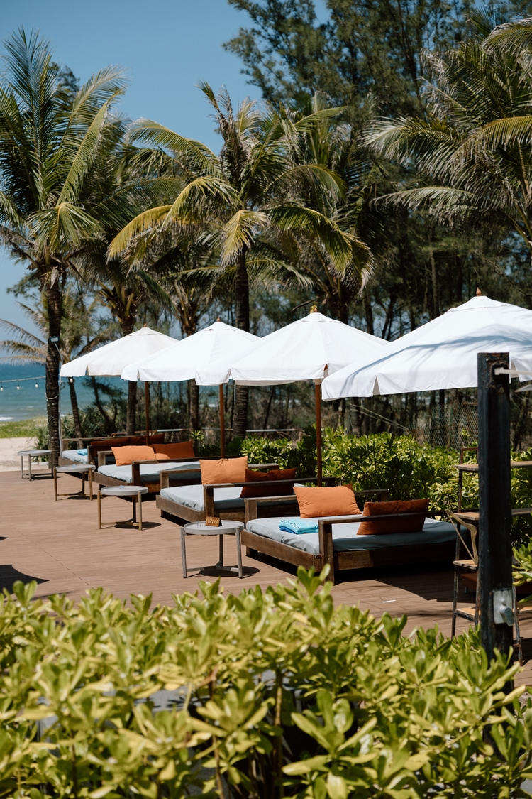 Outdoor leisure area at Blush Beach Club with stunning coastal views and sophisticated ambiance
